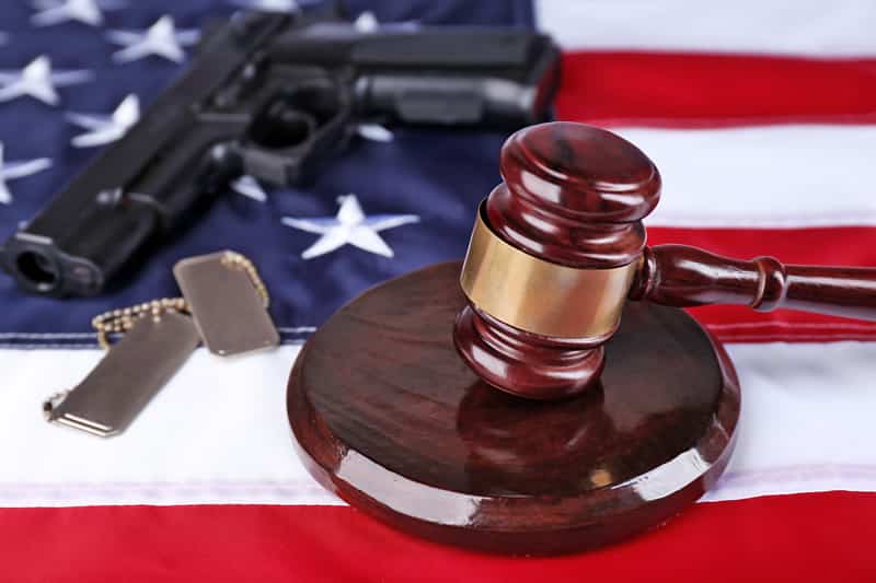 Court Martial with Flag, Firearm, Dog Tags and Gavel.